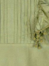 Load image into Gallery viewer, Zoom shot of solid green dress with pom pom detailing